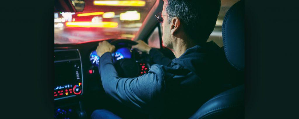 Image of a person driving at night